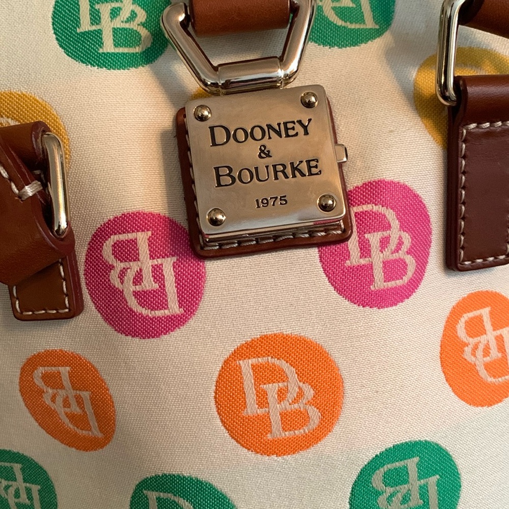 Dooney & Bourke small bucket tote with colorful signature pattern.